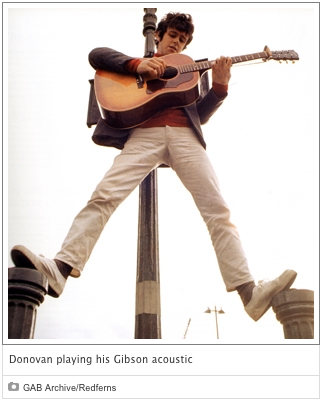 Donovan playing his Gibson acoustic