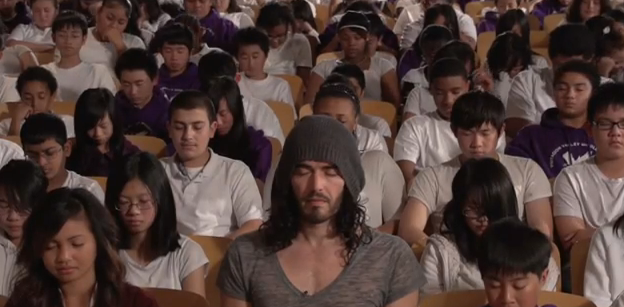 Russell Brand meditates with students in a San Francisco School