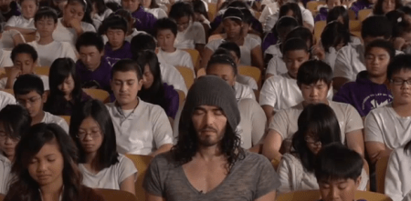Russell Brand meditates with students in a San Francisco School