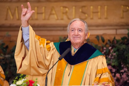 Iowa Senator Tom Harkin gave the sign language symbol for “I love you” after his commencement address at Maharishi University of Management.