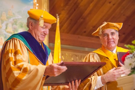 Senator Tom Harkin receives an honorary doctoral degree from M.U.M. President Dr. Bevan Morris.