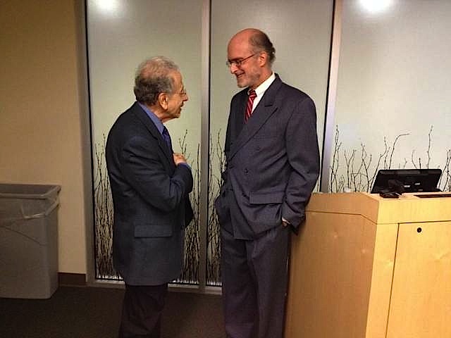 Dr. Francois Abboud, left, talks with Dr. Robert H. Schneider, who spoke with medical staff at University of Iowa Hospitals and Clinics Tuesday about how the practice of Transcendental Meditation can reduce the risk of heart disease and lower blood pressure. / Sara Agnew / Iowa City Press-Citizen