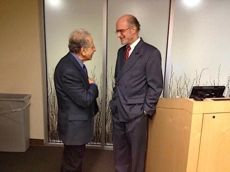 Dr. Francois Abboud, left, talks with Dr. Robert H. Schneider, who spoke with medical staff at University of Iowa Hospitals and Clinics Tuesday about how the practice of Transcendental Meditation can reduce the risk of heart disease and lower blood pressure. / Sara Agnew / Iowa City Press-Citizen