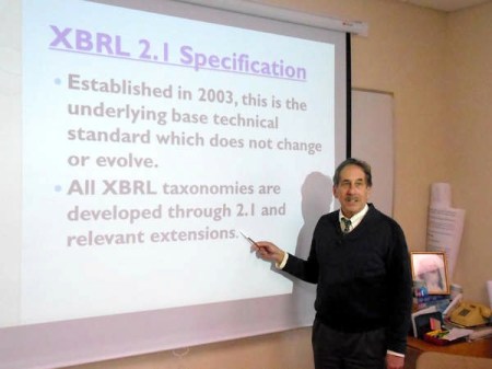 Maharishi University of Management accounting professor Andrew Bargerstock teaches a class in which students are certified in an accounting program called Extensible Business Reporting Language. M.U.M. is the first college in the world to offer certification in the program as part of its academic curriculum. / Photo by: ANDY HALLMAN