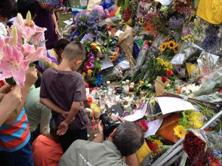 Courtesy of: CRAIG PEARSON People deliver flowers, candles and cards to the home of former president Nelson Mandela in Johannesburg, South Africa, after his death Dec. 5. Maharishi University of Management’s executive vice president Craig Pearson was in the country at the time of Mandela’s death and witnessed how the public responded with kind gestures to the man they admired so much.