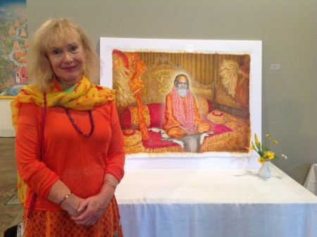 Artist Frances Knight stands in front of her latest painting of Guru Dev, Maharishi's master. Photo taken by Ken Chawkin at ArtFiftyTwo in Fairfield, Iowa